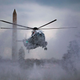 Marine One kicks up snow as it lands on the South Lawn of the White House in Washington, DC, on Feb. 1, 2019, to convey US President Donald Trump to Andrews Air Force Base in neighboring Maryland. Trump is traveling to Palm Beach, Fla.